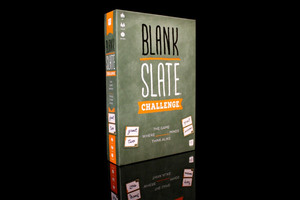 Box of the board game 'Blank Slate Challenge' featuring green and orange design, displaying the title and taglines, with a reflective surface.