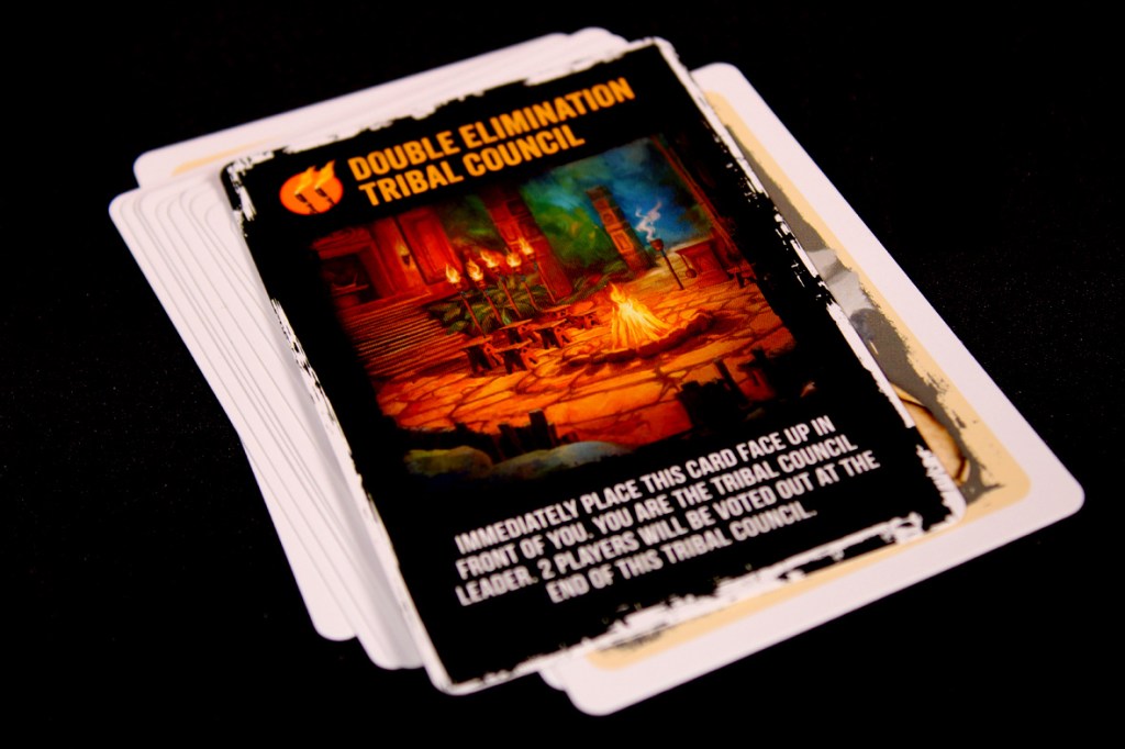 A Double Elimination Tribal Council card from the game Survivor: The Tribe Has Spoken, featuring an illustration of a tribal council setup.