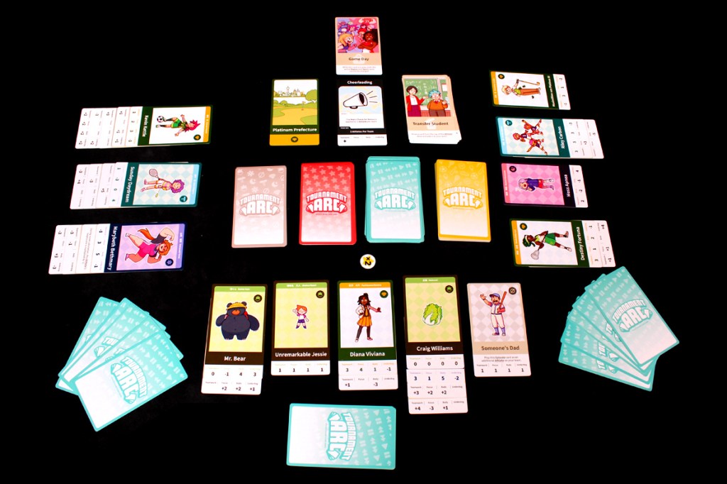 A tabletop game setup for Tournament Arc, showing various character, episode, and region cards, along with a dice and game tokens arranged in a playful layout.