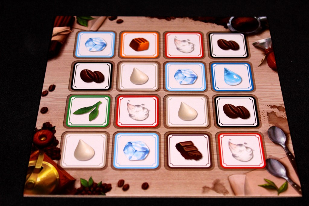 A game board featuring various coffee ingredients and items arranged in a grid layout, including coffee beans, ice, chocolate, and cream, set against a wooden background.