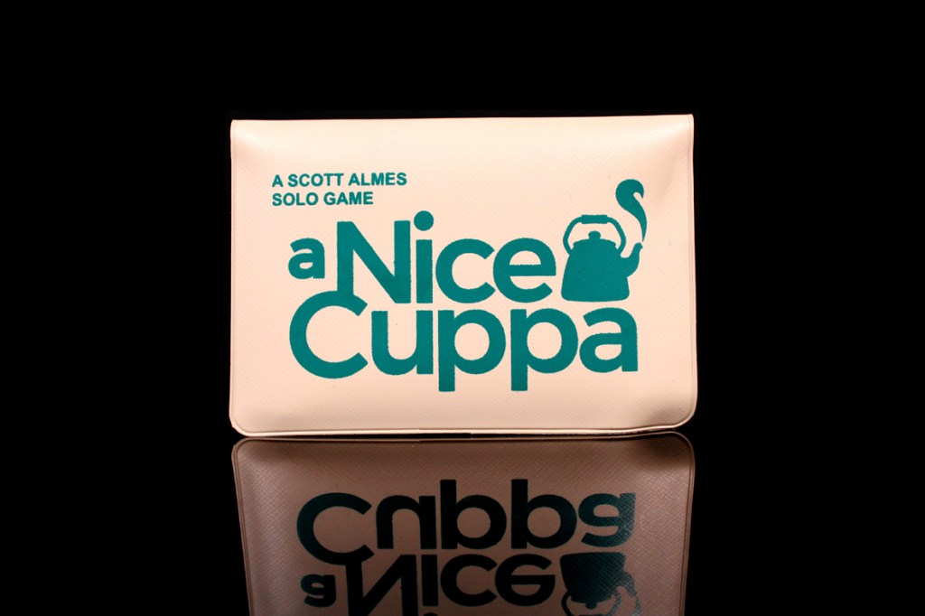 Game box for 'A Nice Cuppa' featuring a teapot graphic and text, reflective surface