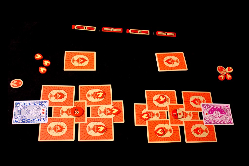 A tabletop game setup showing cards on a black surface, featuring flame-themed illustrations and tokens representing Flame Tokens.