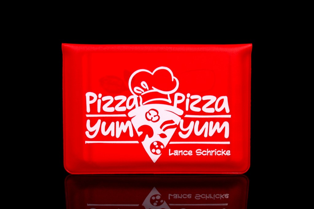 A red game box for 'Pizza Pizza Yum Yum' featuring a pizza slice with a chef's hat and playful typography.