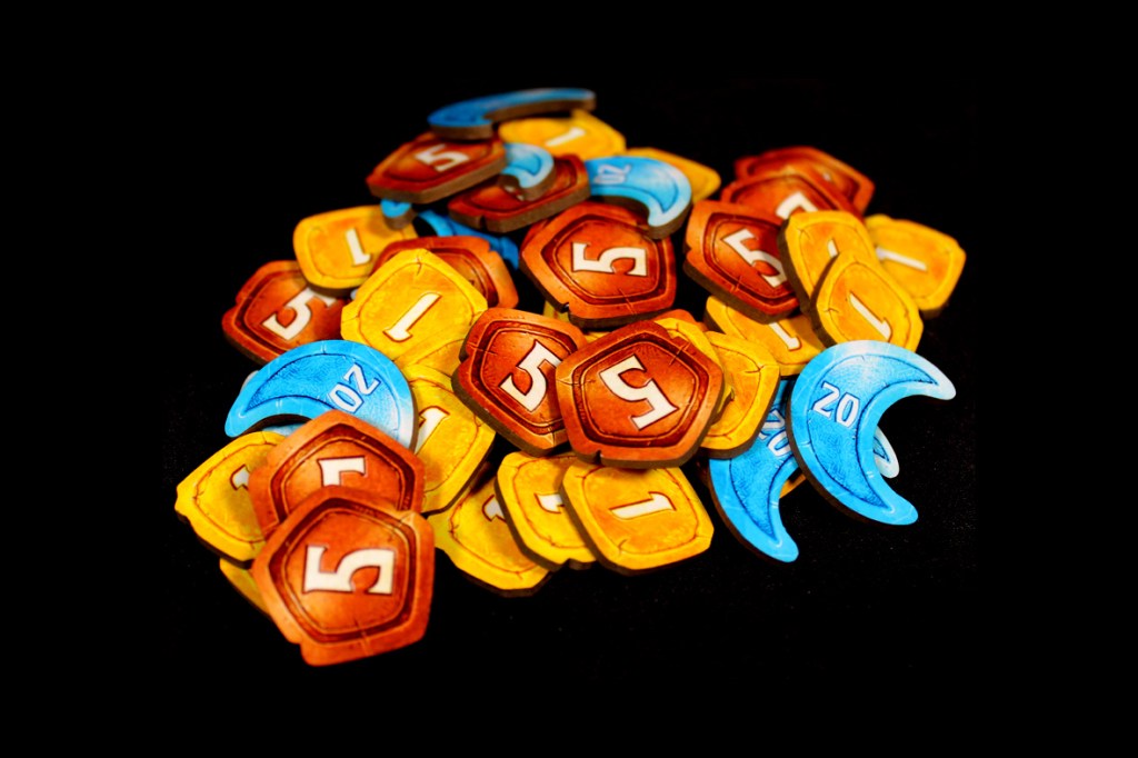 A pile of colorful game tokens featuring various denominations, including 1, 5, and 20, against a black background.