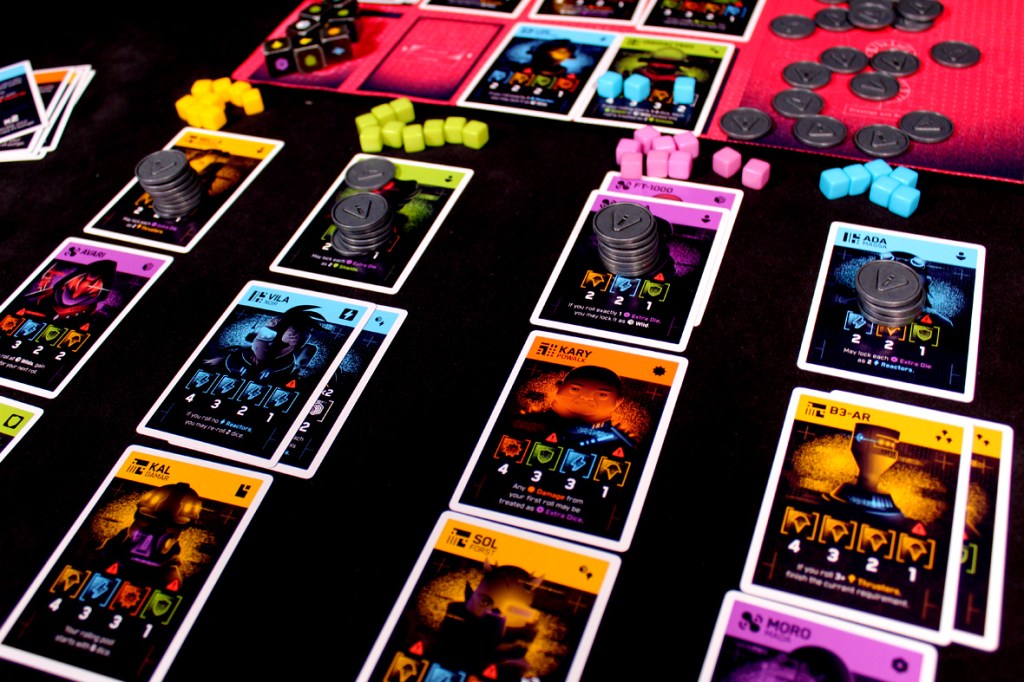 A close-up view of a board game setup featuring various character cards, tokens, and dice on a dark surface.