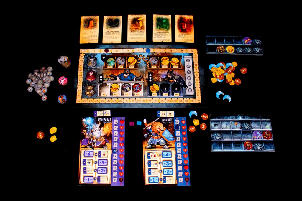 A game setup for Satchel Quest featuring player boards, tokens, chips, and Dungeon Maps on a black surface.