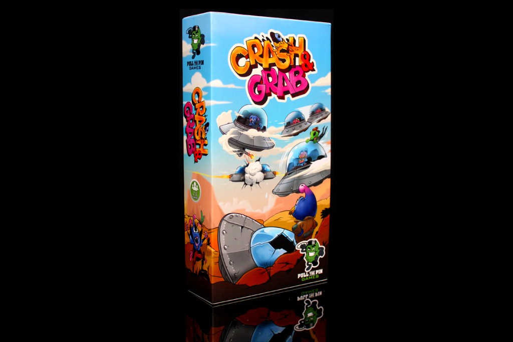 Box cover of the board game 'Crash & Grab' featuring colorful artwork with cartoonish alien characters and flying saucers.