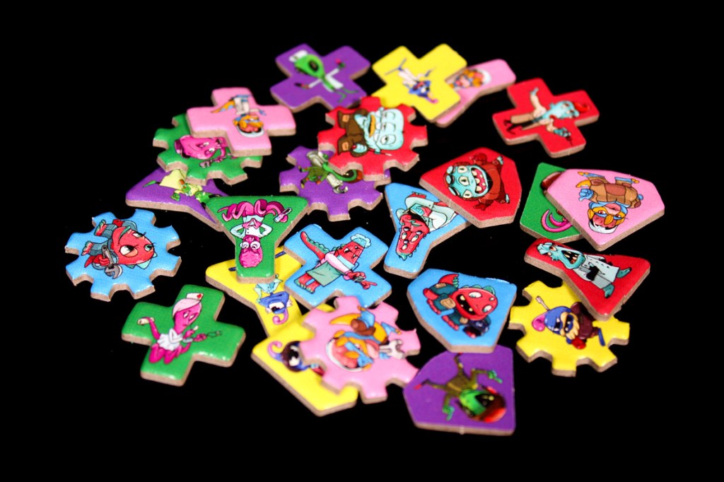 A collection of colorful game pieces featuring various cartoon characters on a black background.