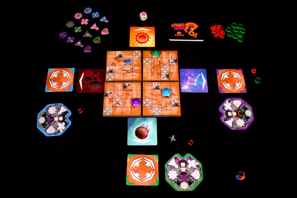 A tabletop game setup for 'Crash & Grab' featuring game tiles, player tokens, and various game components arranged on a black surface.