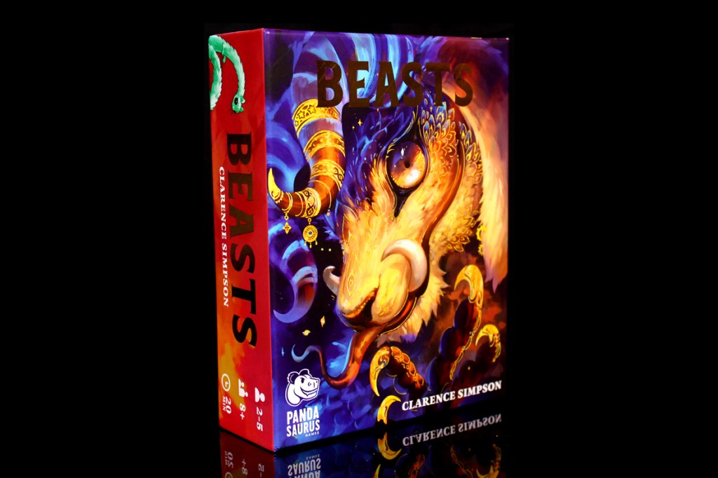 A colorful board game box for 'Beasts' by Clarence Simpson, featuring vibrant artwork of a mythical creature, reflecting a fantasy theme.