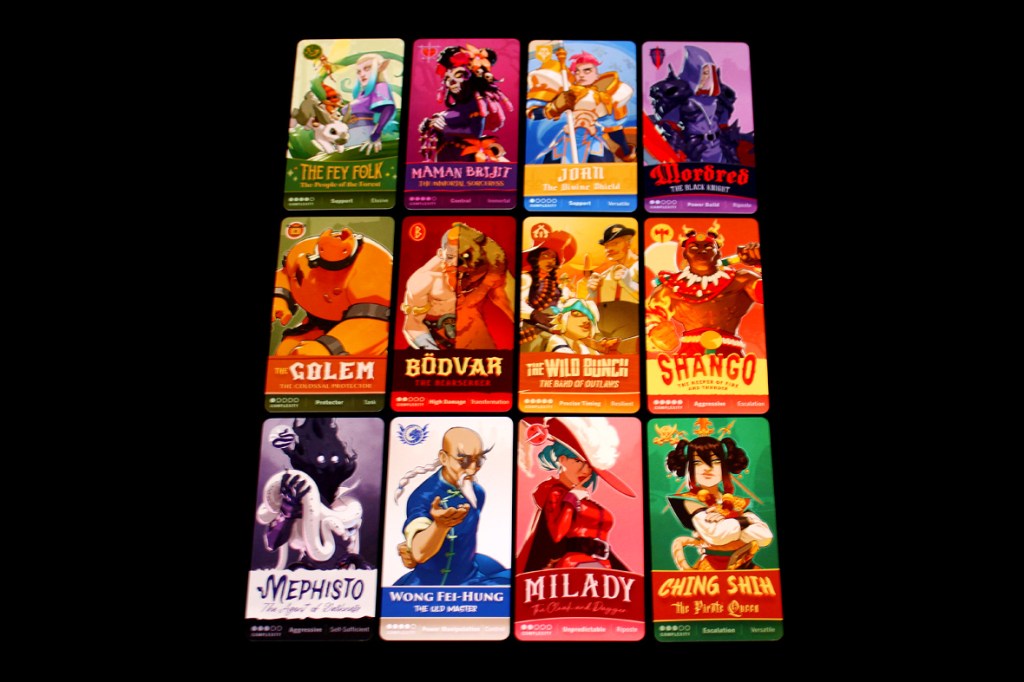 A collection of character cards from the board game Tag Team, showcasing various fighters, their names, and attributes, arranged in a grid on a black background.