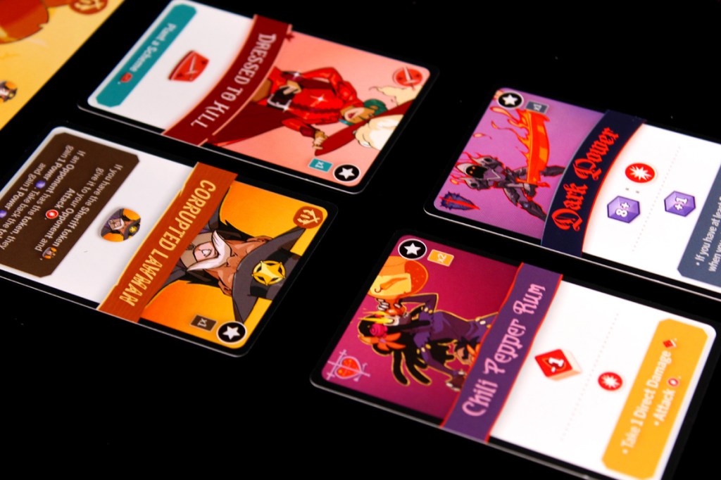 An assortment of character cards from the game Tag Team, featuring colorful artwork and details like attack power and special abilities.