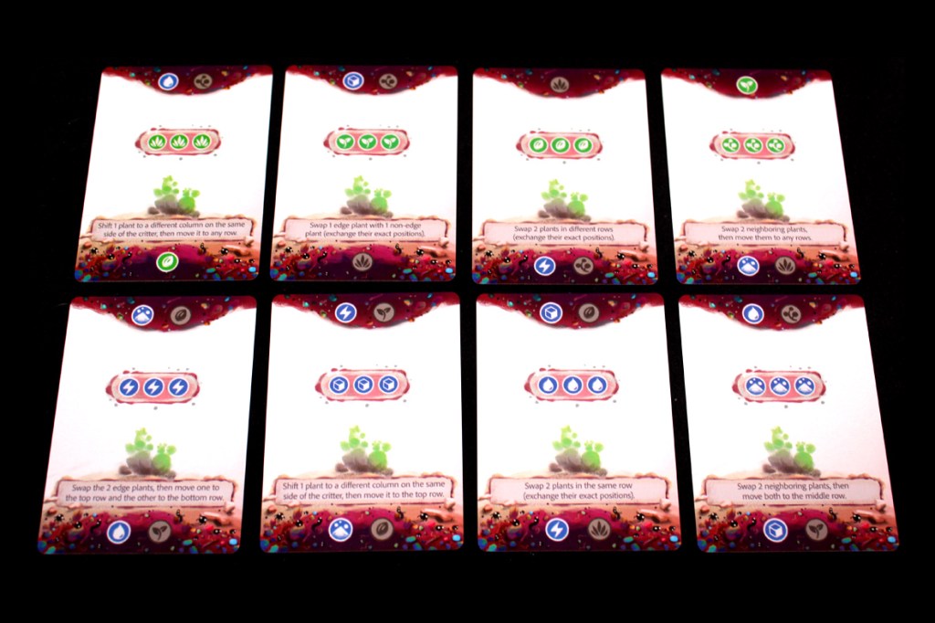 A layout of eight game cards from the board game 'Glass Garden', featuring various plant-themed actions and symbols for gameplay instructions.