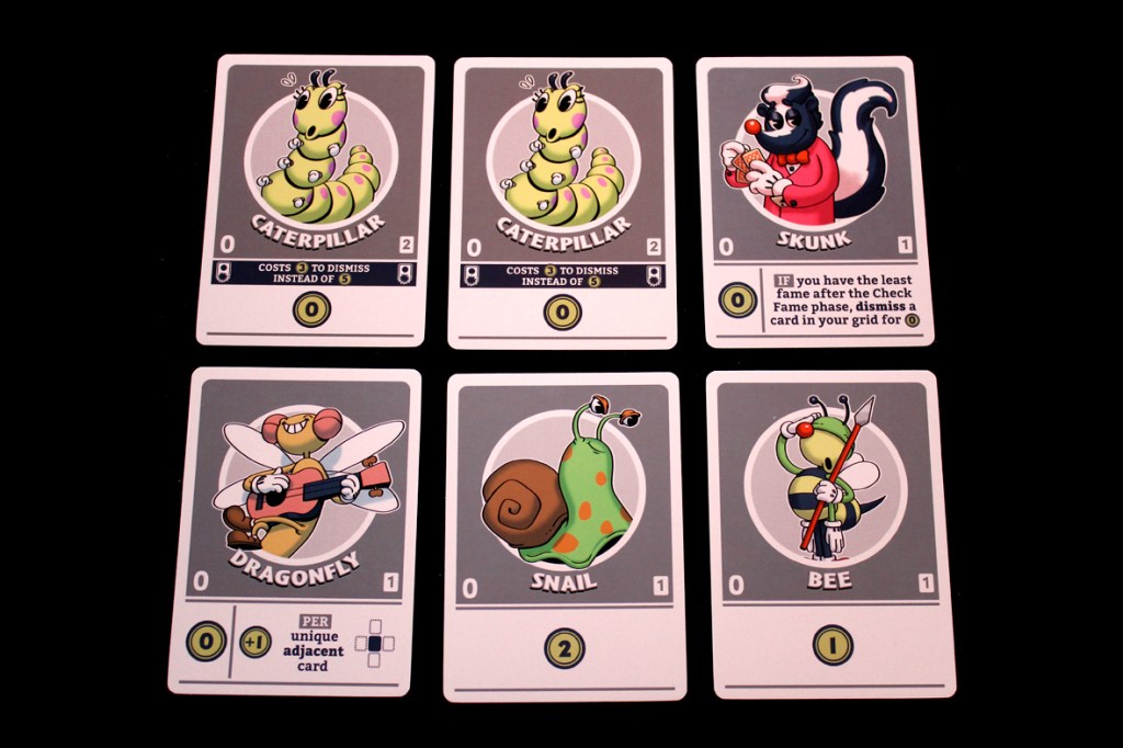 A collection of playing cards from the game FlipToons featuring cartoon characters including a Caterpillar, Skunk, Dragonfly, Snail, and Bee, each with unique abilities and stats.