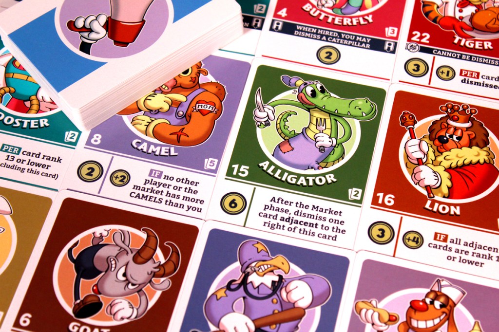 A close-up of several game cards from FlipToons, including cartoon character illustrations and game mechanics text.