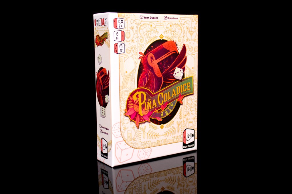 Box cover of the board game Piña Coladice featuring colorful artwork and the game title prominently displayed.