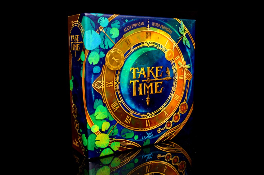 A close-up of the board game box for 'Take Time,' featuring an intricate design with clocks and a vibrant color scheme, displaying the title and player information.