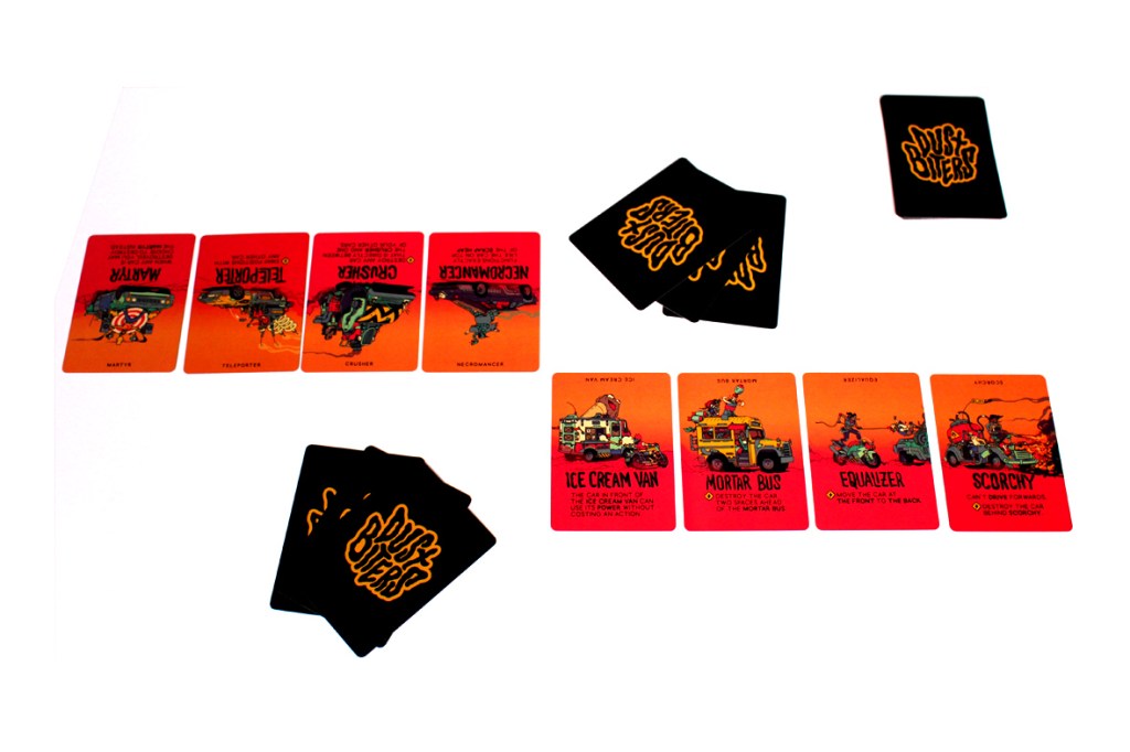 A tabletop game setup featuring multiple cards from Dustbiters: Pocket Edition, including character and vehicle cards, arranged in two rows with a set of player cards in hand.