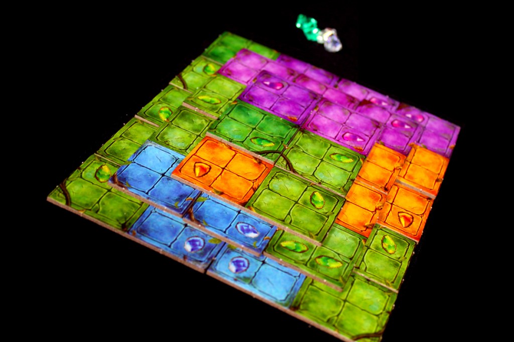 Colorful game board of Pyramido: Forgotten Treasures displaying various tile patterns and colors.