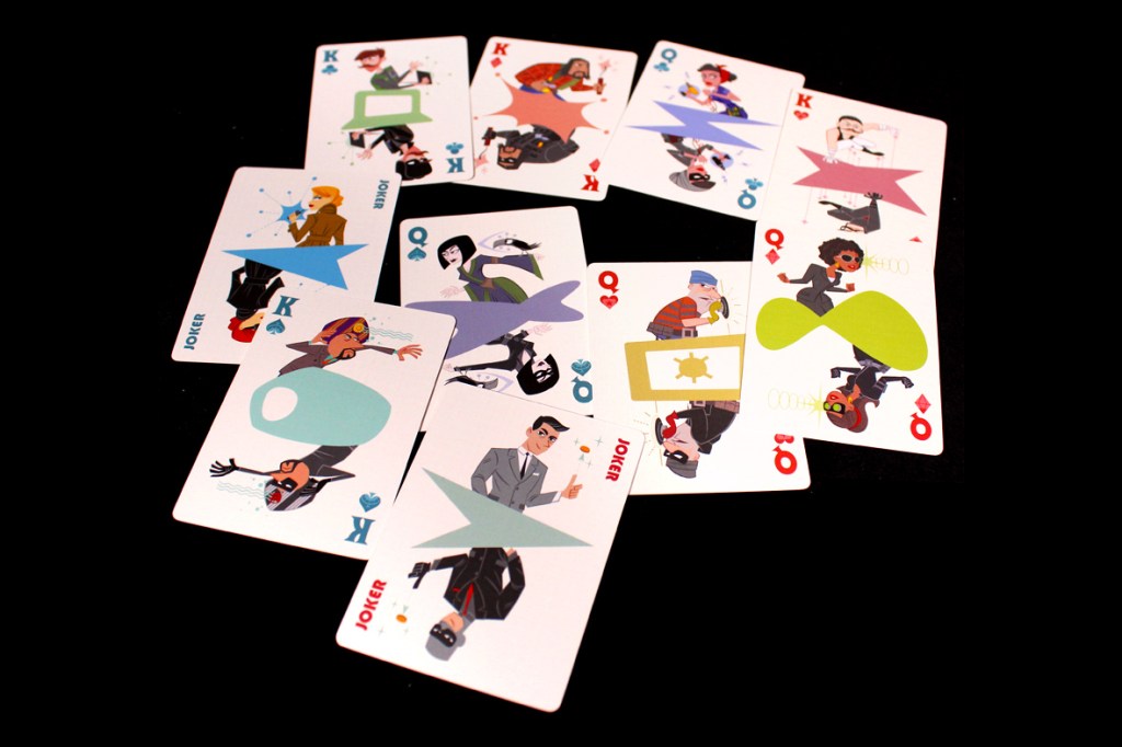 A colorful deck of playing cards featuring cartoonish illustrations of various characters and motifs, including jokers, kings, queens, and thematic designs.