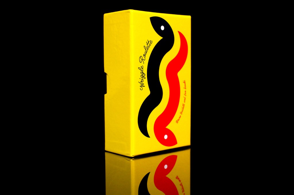 A colorful yellow box with black, red, and yellow wavy designs and the text 'Wiggle Roulette' on the front.