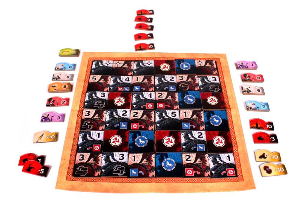 A colorful board game layout featuring a central game board with various icons and numbers, surrounded by player tokens and scoring chips on the sides.