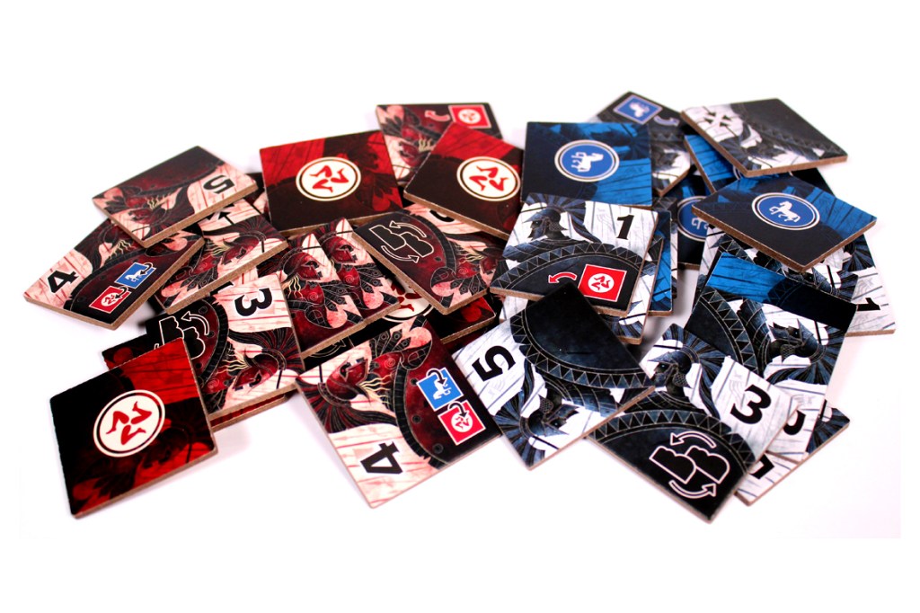 A collection of game tiles featuring various numbers and designs in red, black, and blue colors, scattered on a white background.